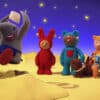 Still from interactive kids media show, Mixmups. Three animated children in playsuits are on the moon. One is in a wheelchair with a dog besides them. They are watching an animated elephant jump into a moon crater.